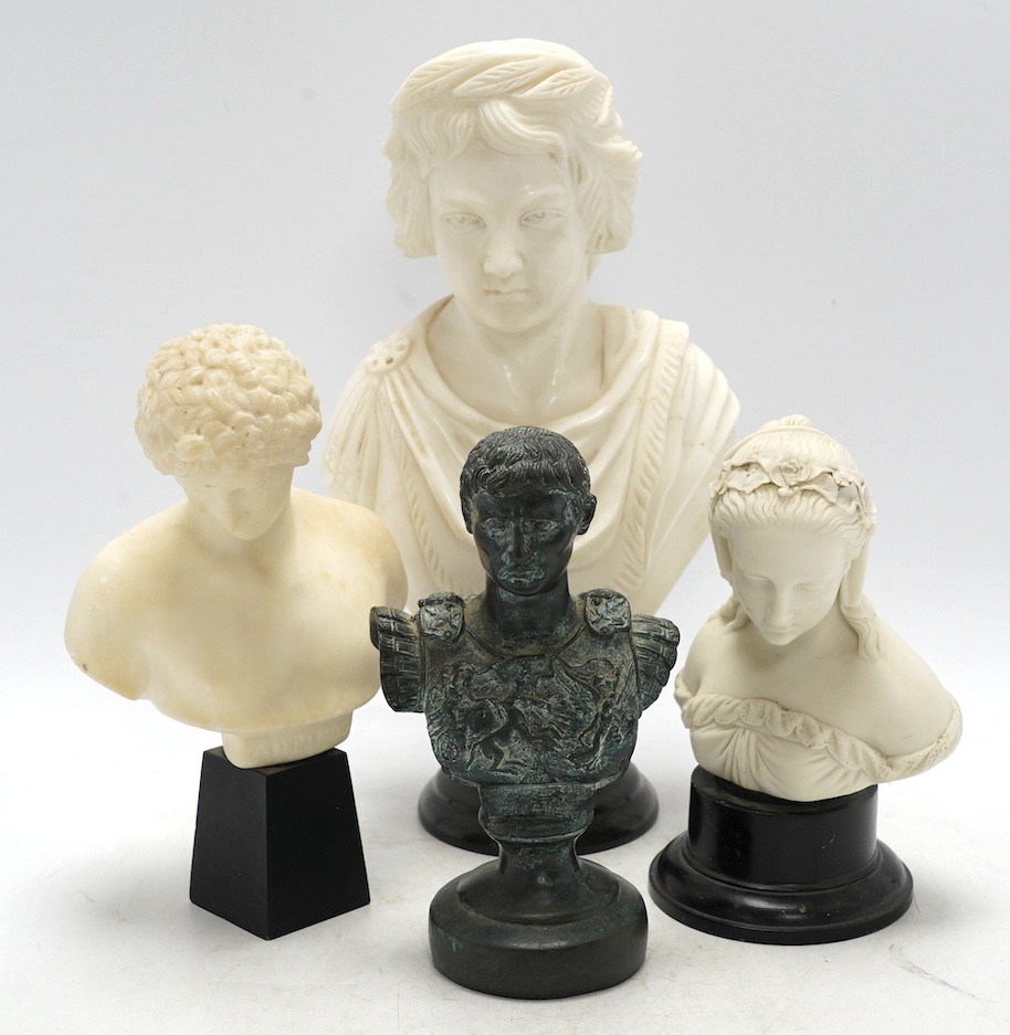 An alabaster bust of Anthony, a larger marble bust, a Parian bust on stand of a girl and a bronze bust of Julius Caesar, tallest 31cm high (4). Condition - Parian ware bust fair, other three good